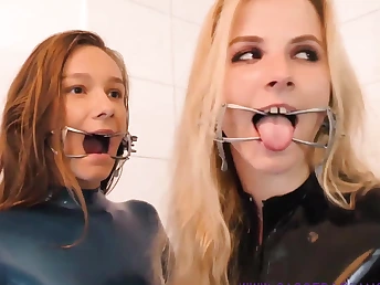 Four horny babes wearing latex and high heels shacking up in a nasty similar to one another